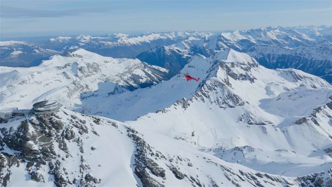 The Volvo ECR25 brought in by helicopter across the Swiss Alps