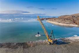 Munck Civil Engineering is using a Liebherr HS8200 duty cycle crawler crane to dredge the seabed in Ilulissat, Greenland, ahead of the construction of a new airport