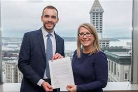 Agreement signing - Michelle Allison, GM of King County Metro and Javier Iriarte, CEO of Solaris Bus & Coach