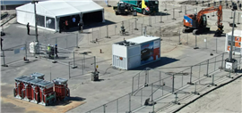 Image showing an Hitachi Energy hydrogen-powered generator charging a battery electric excavator at Air Products’ Rotterdam site. (Image: Hitachi Energy)