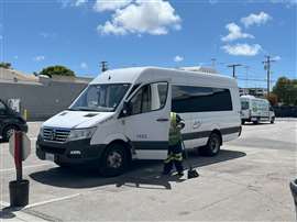 Zeem Solutions service technican cleaning an electric vehicle at the LAX Depot