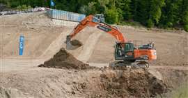 KIBAG is operating the Develon DX225LC-7X excavator, which uses the AI-powered Real-X system, in a former quarry in Tuggen, Switzerland (Image: Develon)