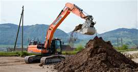 KIBAG is operating the Develon DX225LC-7X excavator, which uses the AI-powered Real-X system, in a former quarry in Tuggen, Switzerland (Image: Develon)