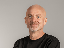man with beard in black t-shirt